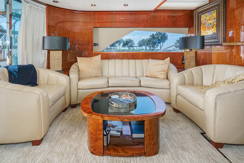 Compass Rose Yacht Photos Pics Luxurious interior of 2006 Fairline 74 Custom yacht with elegant seating and wooden accents.