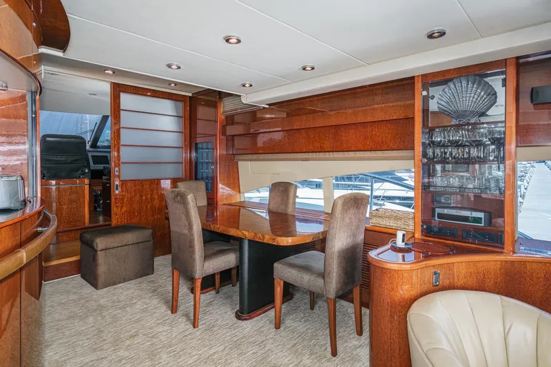 Compass Rose Yacht Photos Pics Luxurious interior of 2006 Fairline 74 Custom yacht with elegant dining area.