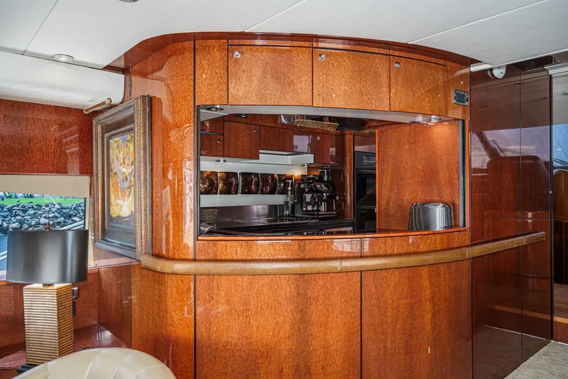 Compass Rose Yacht Photos Pics Luxurious wooden interior of 2006 Fairline 74 Custom yacht kitchen area.