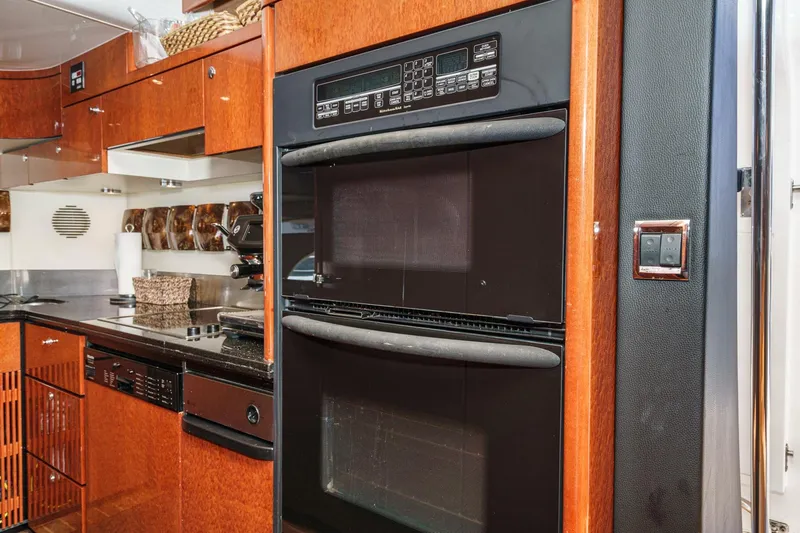 Compass Rose Yacht Photos Pics Luxury kitchen interior of 2006 Fairline 74 Custom yacht with modern appliances.