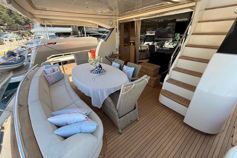  Yacht Photos Pics Luxurious 2008 Evo Marine Deauville 76 yacht deck with elegant seating and dining area.