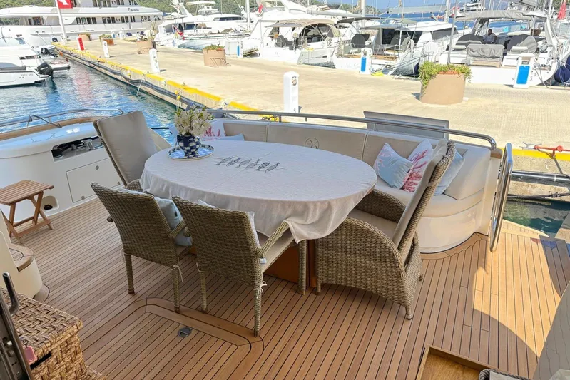  Yacht Photos Pics Luxury Evo Marine Deauville 76 yacht deck with elegant outdoor dining area, 2008 model.