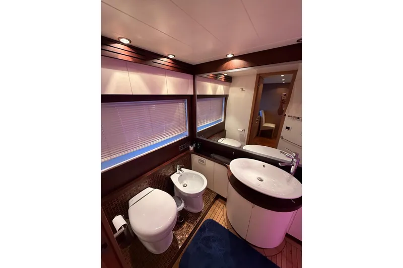  Yacht Photos Pics Luxurious bathroom in 2008 Evo Marine Deauville 76 yacht with modern fixtures and elegant design.