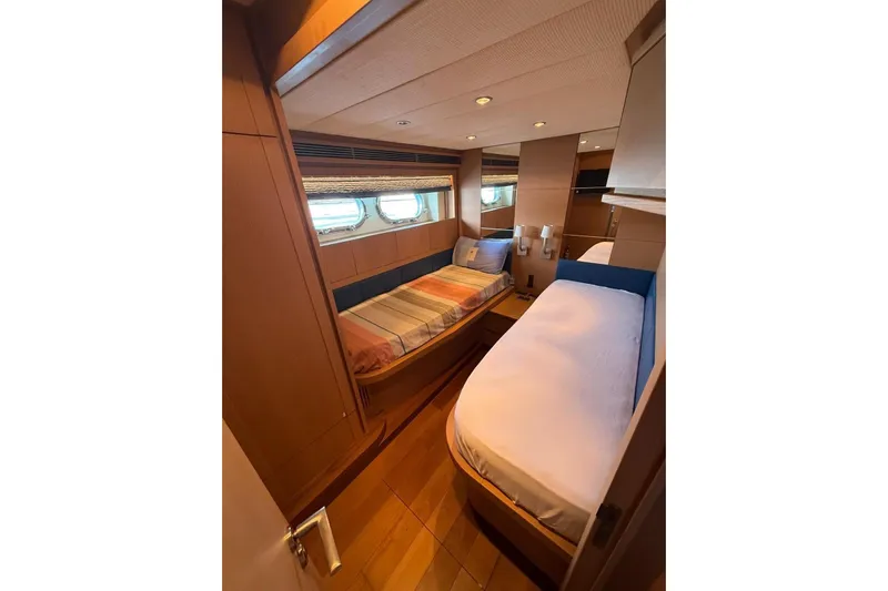  Yacht Photos Pics Interior cabin of 2008 Evo Marine Deauville 76 yacht with twin beds and wooden finish.