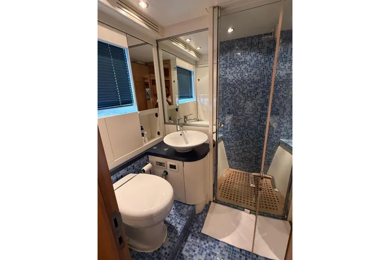  Yacht Photos Pics Luxurious bathroom in 2008 Evo Marine Deauville 76 yacht with modern fixtures and mosaic tiles.