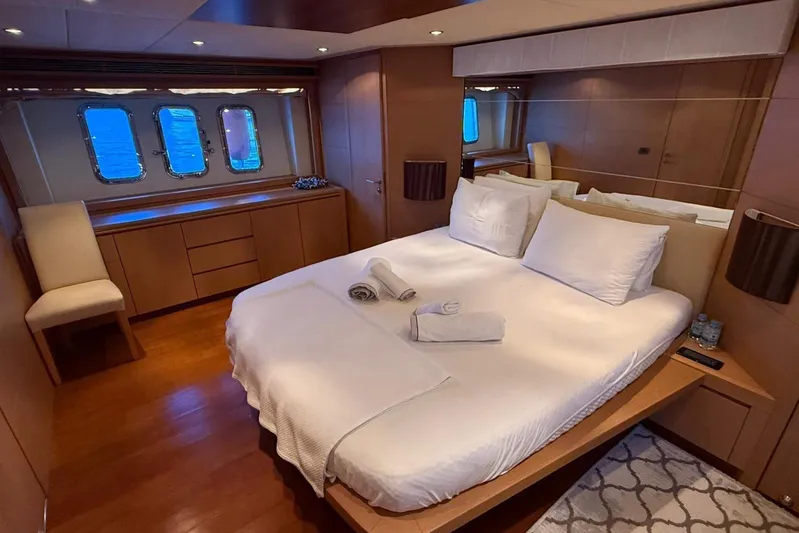  Yacht Photos Pics Luxurious bedroom interior of 2008 Evo Marine Deauville 76 yacht with elegant furnishings.