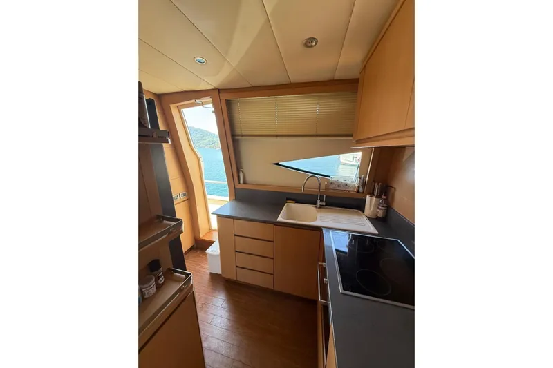  Yacht Photos Pics Interior of 2008 Evo Marine Deauville 76 yacht kitchen with modern amenities and sea view.