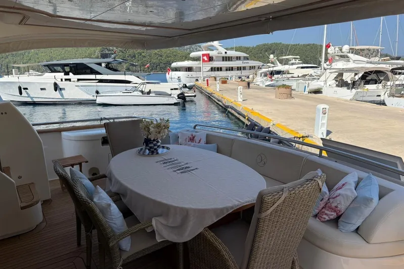  Yacht Photos Pics Luxury yacht Evo Marine Deauville 76, 2008, docked with elegant outdoor dining area.