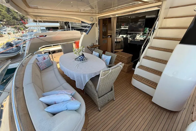  Yacht Photos Pics Luxurious 2008 Evo Marine Deauville 76 yacht deck with elegant seating and dining area.