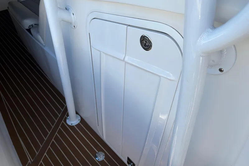  Yacht Photos Pics 2012 Nor-Tech 340 Sport Center Console, white storage compartment, teak-style flooring.