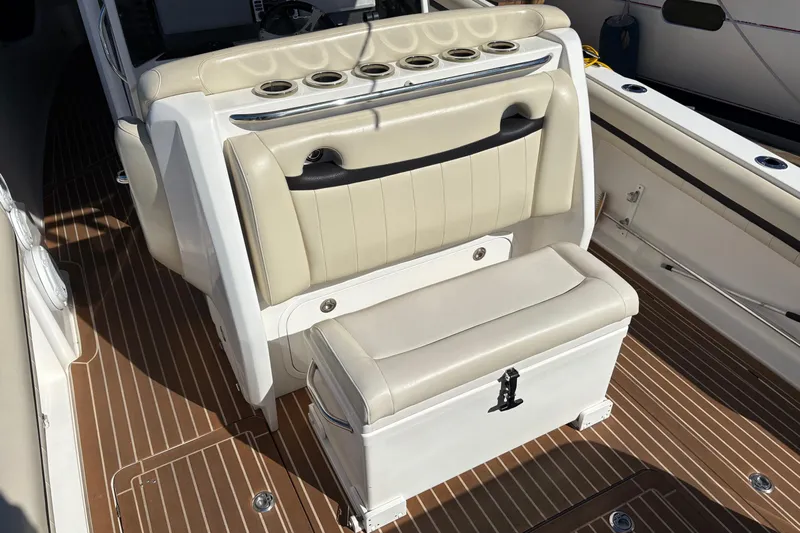  Yacht Photos Pics 2012 Nor-Tech 340 Sport Center Console interior with beige seating and wood-patterned flooring.