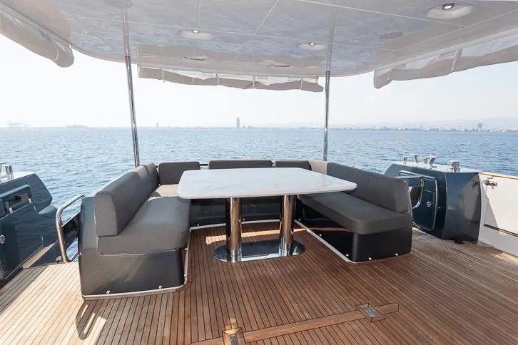 Grey T Yacht Photos Pics Luxurious Azimut Magellano 66 yacht deck with elegant seating and ocean view, 2021 model.