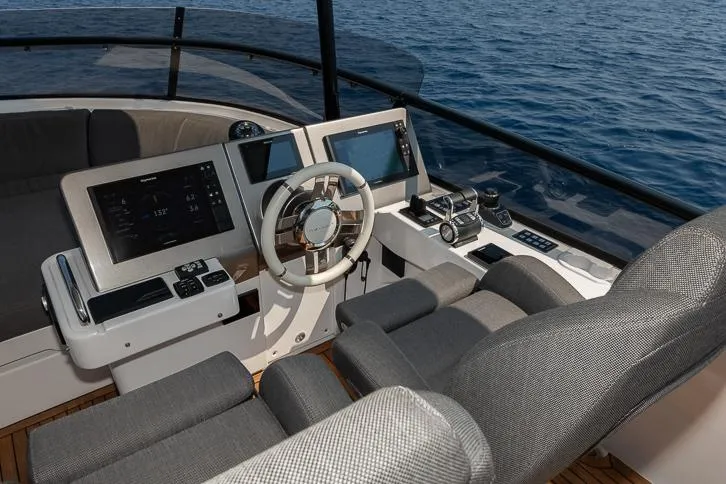 Grey T Yacht Photos Pics Helm of 2021 Azimut Magellano 66 yacht with modern navigation equipment.