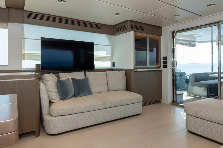 Grey T Yacht Photos Pics Luxurious interior of 2021 Azimut Magellano 66 yacht with modern sofa and TV.