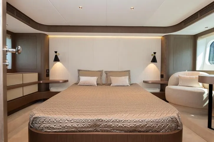 Grey T Yacht Photos Pics Luxurious bedroom interior of 2021 Azimut Magellano 66 yacht with modern design and cozy ambiance.