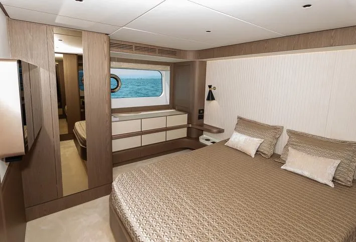 Grey T Yacht Photos Pics Luxurious bedroom interior of 2021 Azimut Magellano 66 yacht with ocean view.