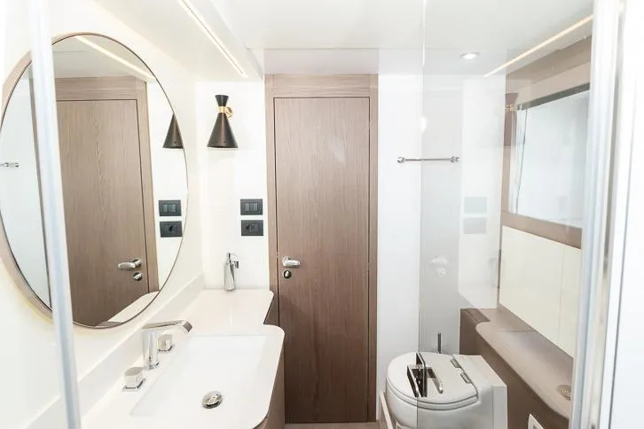 Grey T Yacht Photos Pics Bathroom interior of 2021 Azimut Magellano 66 yacht, featuring modern fixtures and elegant design.