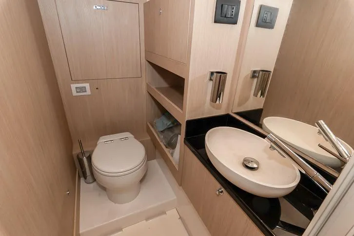 Grey T Yacht Photos Pics Luxurious bathroom in 2021 Azimut Magellano 66 yacht, featuring modern fixtures and elegant design.