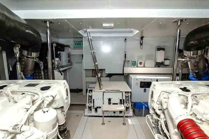 Grey T Yacht Photos Pics Engine room of 2021 Azimut Magellano 66 yacht, featuring dual engines and control systems.