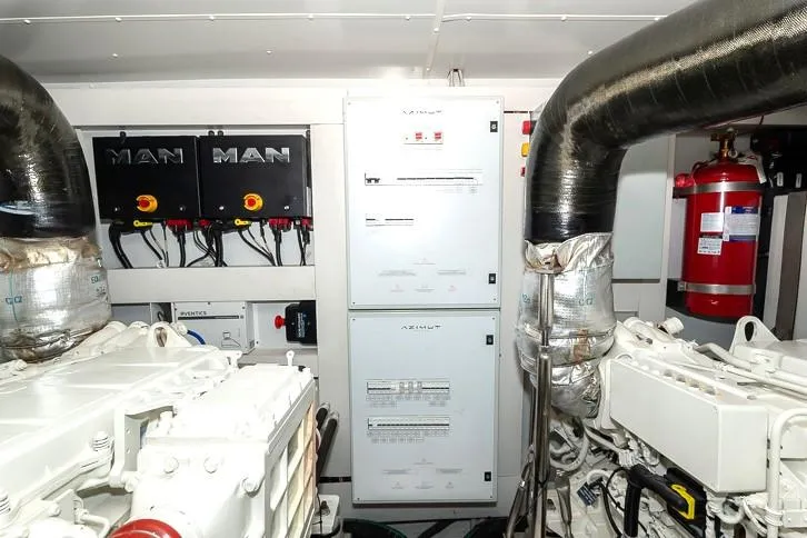 Grey T Yacht Photos Pics Engine room of 2021 Azimut Magellano 66 yacht with MAN engines and control panels.