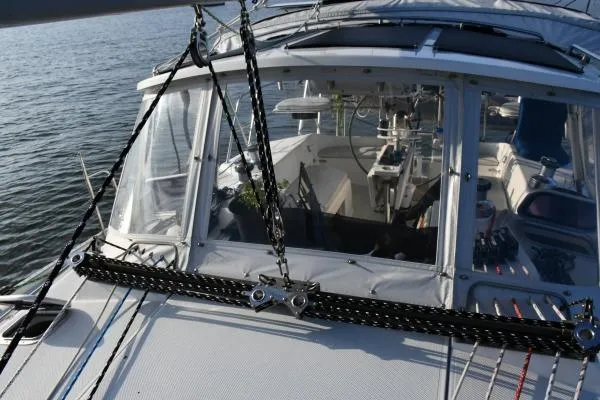Mandala Yacht Photos Pics 2002 Catalina 42 MkII sailboat cockpit with ropes and steering wheel, docked on calm water.