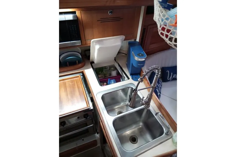 Mandala Yacht Photos Pics Galley kitchen in 2002 Catalina 42 MkII sailboat with double sink and appliances.