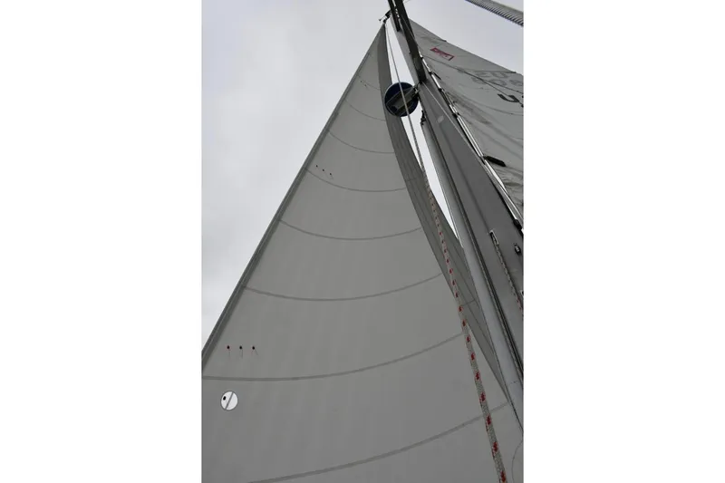 Mandala Yacht Photos Pics Sail of a 2002 Catalina 42 MkII yacht against a cloudy sky.