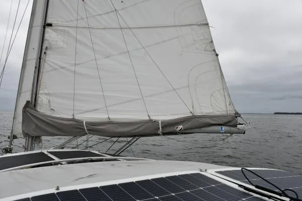 Mandala Yacht Photos Pics Sailing on a 2002 Catalina 42 MkII with solar panels, under cloudy skies.