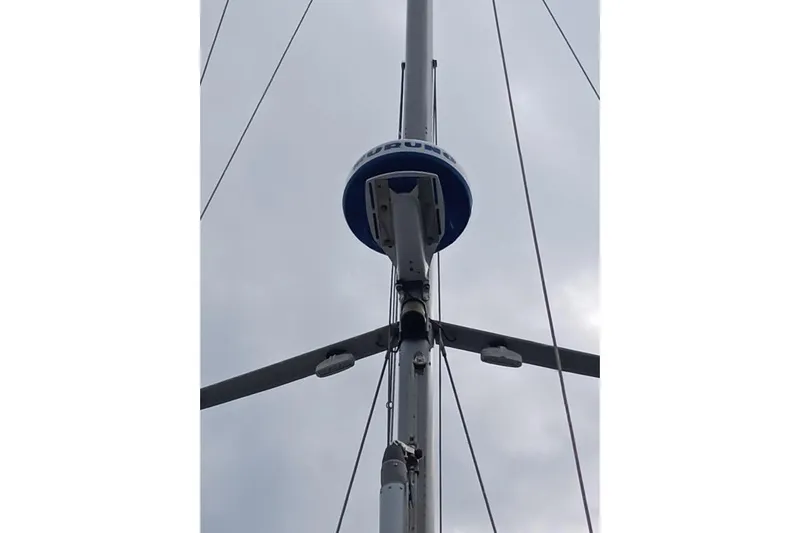 Mandala Yacht Photos Pics Mast of 2002 Catalina 42 MkII sailboat against cloudy sky.
