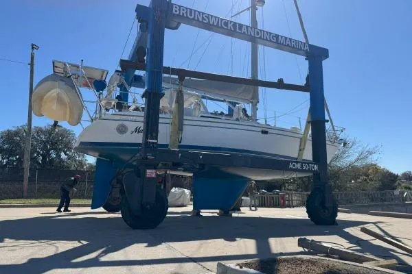Mandala Yacht Photos Pics Catalina 42 MkII sailboat at Brunswick Landing Marina, 2002 model, on a lift for maintenance.