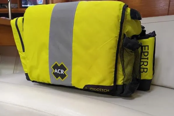 Mandala Yacht Photos Pics Bright yellow ACR EPIRB ditch bag on a Catalina 42 MkII sailboat.