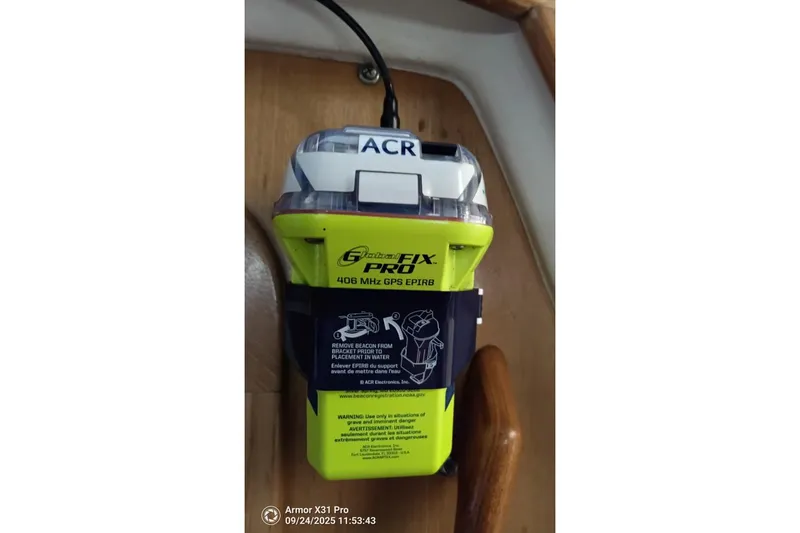 Mandala Yacht Photos Pics EPIRB device on Catalina 42 MkII yacht, 2002 model, mounted on wooden panel.