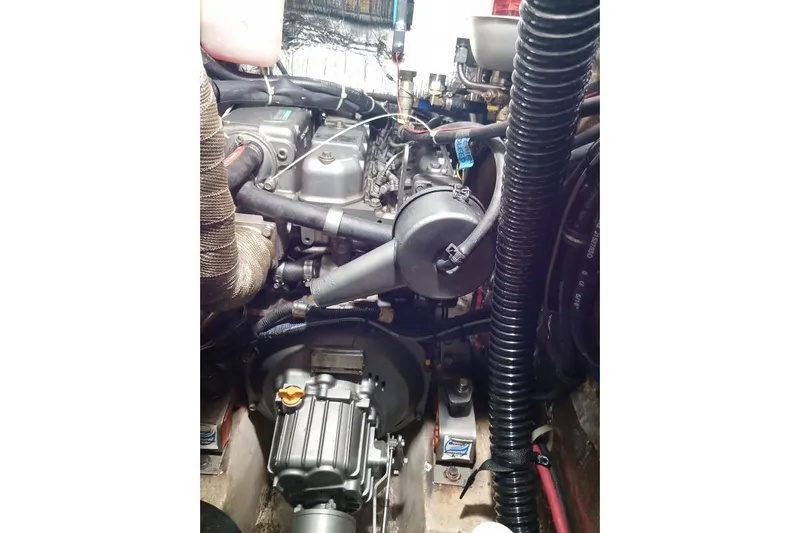 Mandala Yacht Photos Pics Engine compartment of a 2002 Catalina 42 MkII sailboat, showcasing mechanical components.