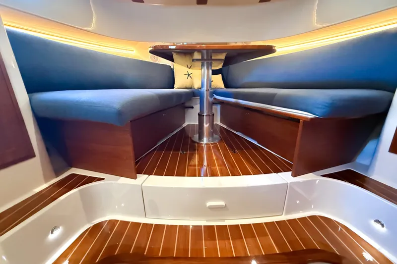  Yacht Photos Pics Interior of 2021 Hinckley Sport Boats 40x with elegant seating and wooden flooring.