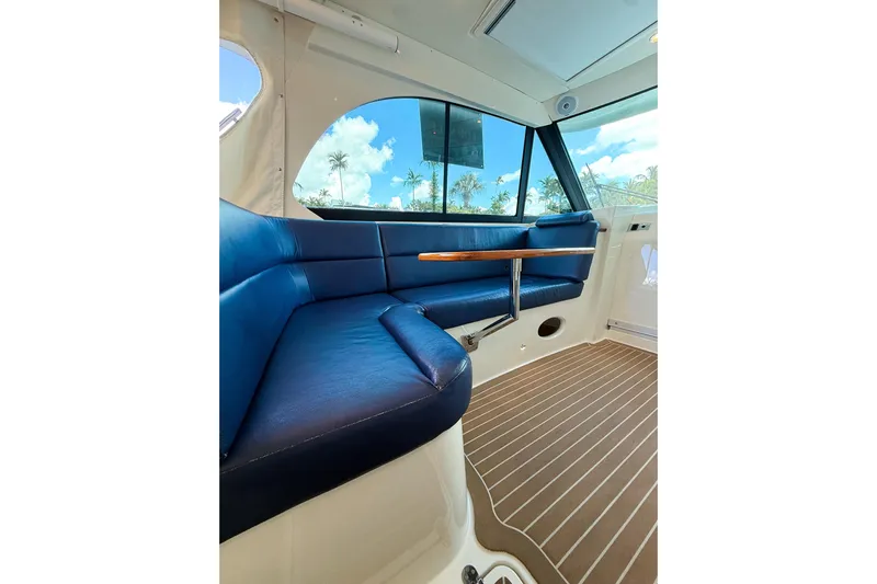  Yacht Photos Pics Interior of 2021 Hinckley Sport Boats 40x with blue seating and wooden flooring.