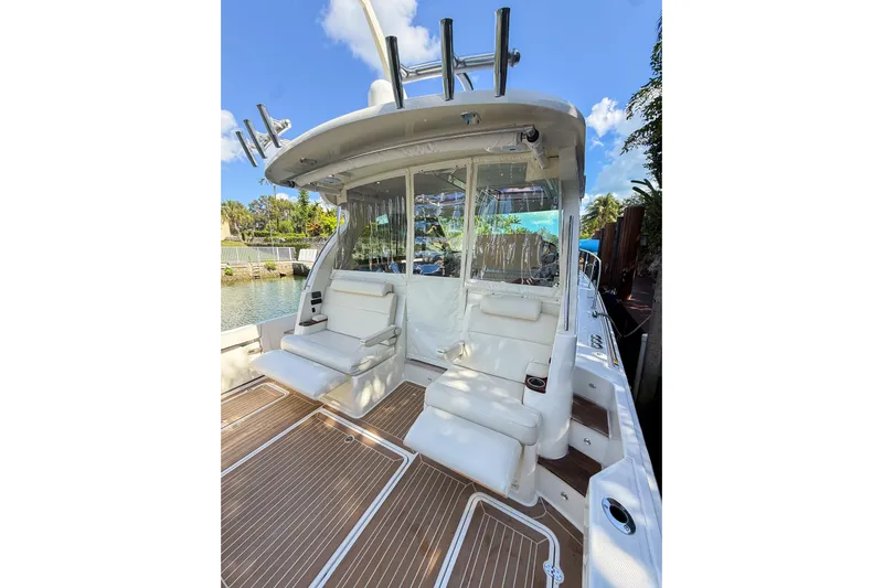  Yacht Photos Pics 2021 Hinckley Sport Boats 40x with luxurious seating and sleek design on a sunny day.