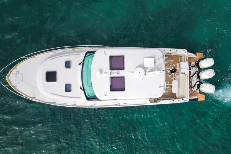  Yacht Photos Pics Aerial view of 2021 Hinckley Sport Boats 40x on turquoise water.