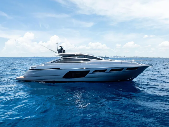 Our Trade Yacht Photos Pics 2024 Pershing 6X yacht cruising on open blue sea under clear sky.