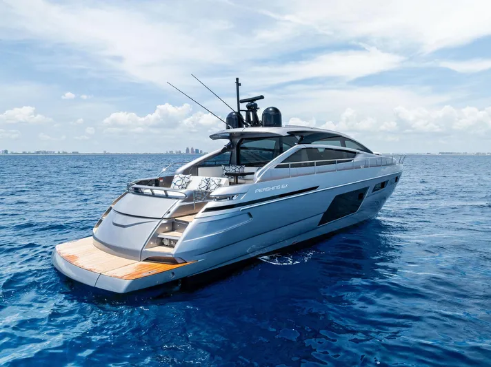 Our Trade Yacht Photos Pics 2024 Pershing 6X yacht cruising on open sea under clear skies.