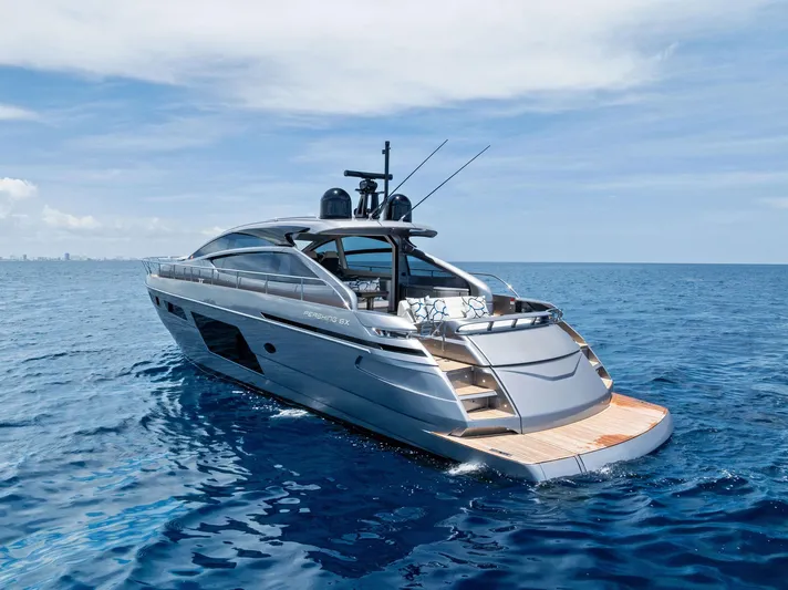 Our Trade Yacht Photos Pics 2024 Pershing 6X luxury yacht cruising on open sea under clear skies.