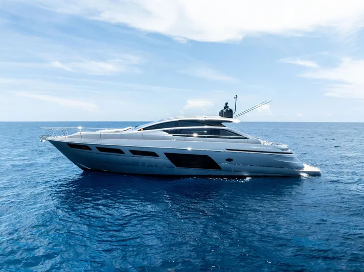 Our Trade Yacht Photos Pics 2024 Pershing 6X yacht cruising on open sea under clear blue sky.