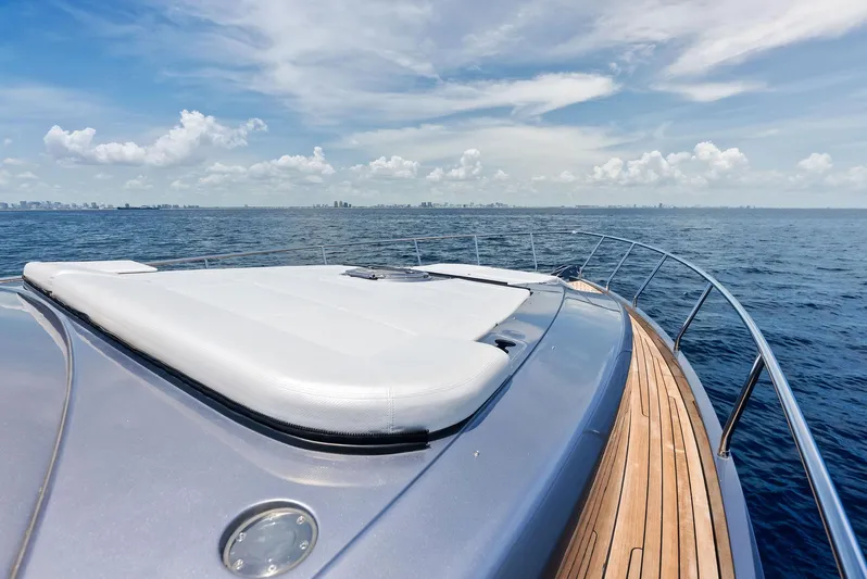 Our Trade Yacht Photos Pics 2024 Pershing 6X yacht deck with ocean view and clear sky.