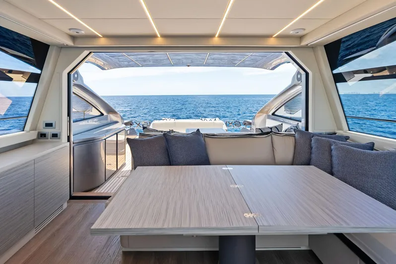 Our Trade Yacht Photos Pics Luxurious interior of 2024 Pershing 6X yacht with ocean view.