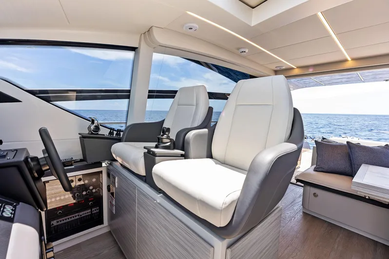 Our Trade Yacht Photos Pics Interior of 2024 Pershing 6X yacht with luxurious seating and ocean view.