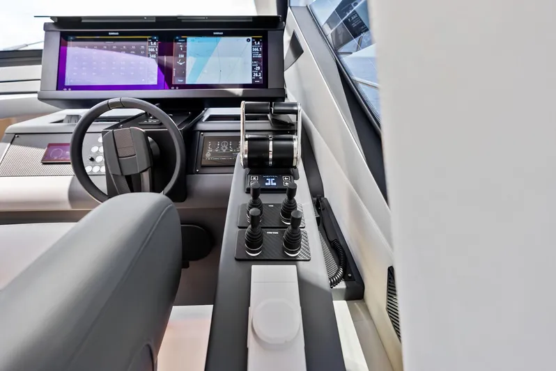 Our Trade Yacht Photos Pics 2024 Pershing 6X yacht helm with advanced navigation controls and digital displays.