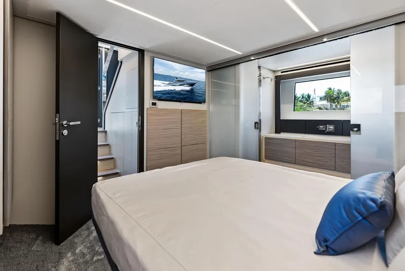 Our Trade Yacht Photos Pics Luxurious interior of 2024 Pershing 6X yacht with modern bedroom and sleek design.