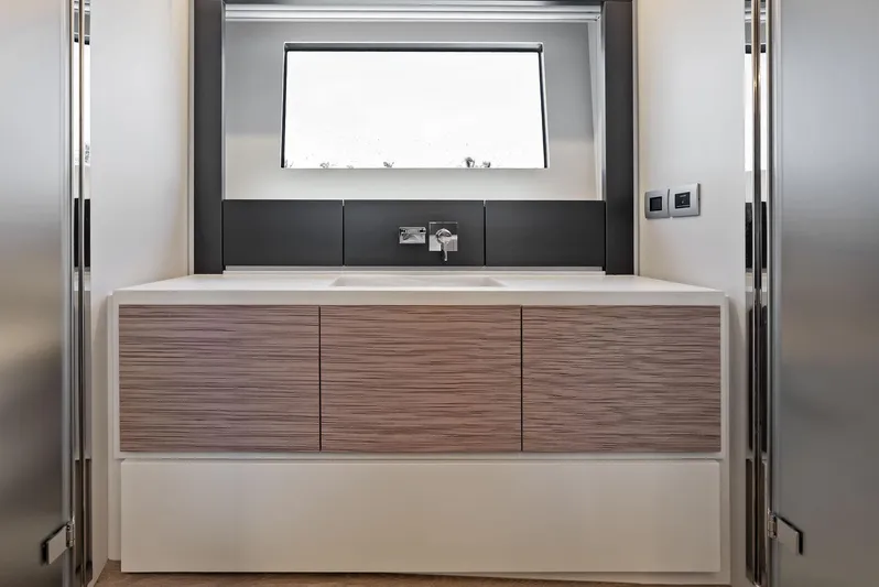 Our Trade Yacht Photos Pics Modern bathroom vanity in 2024 Pershing 6X yacht, featuring sleek design and minimalist aesthetics.
