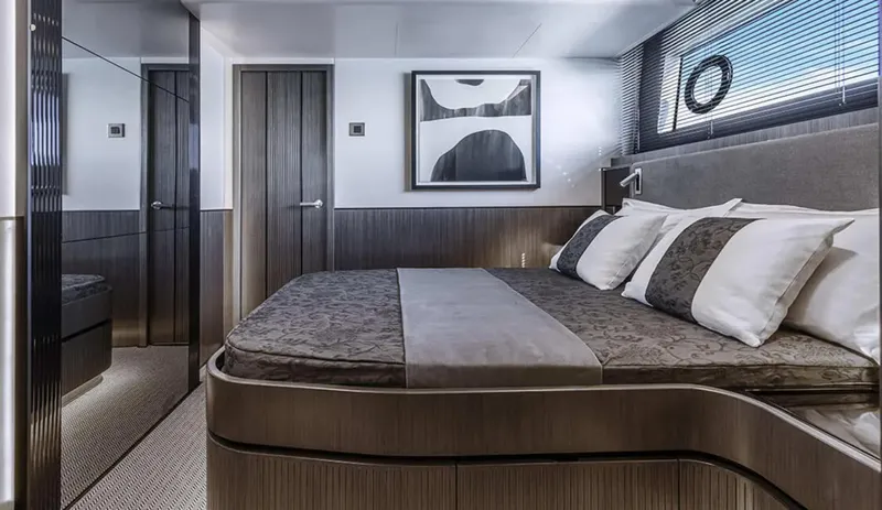  Yacht Photos Pics Luxurious bedroom interior of 2025 Pearl 72 yacht with modern design and elegant decor.
