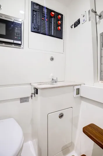 China Girl Yacht Photos Pics 2020 Valhalla V-41 boat interior with control panel and compact bathroom amenities.