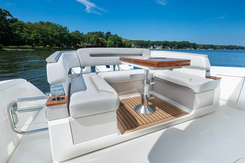  Yacht Photos Pics Manufacturer Provided Image: 2025 Tiara Yachts 38 LS luxury seating area with table on a sunny day.